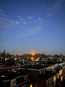 Rising pink moon over Utrecht NL