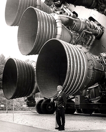 Rocket engineer Wernher von Braun in front of his Saturn V engine 