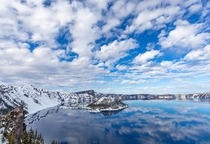 Scattered clouds reflected in Crater Lake OR 