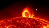 SDO Sees Fiery Looping Rain on the -- a moderately powerful solar flare 