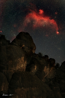 Seagull Nebula rising over rocks at Pinnacles National Park -- Yes this is real its just too dim for you to see with the naked eye 
