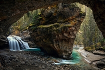 Secluded cavern along Johnston Canyon in Banff National Park Rocky Mountains Alberta Canada  photo Marko Stavric