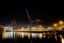 Shipping Container Terminal at night in Hamburg Germany  by Chr Bhm