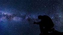 Silhouette Of A Man Under The Stars And Galaxy Image