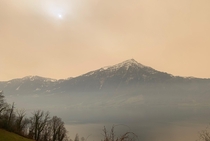 Sky over Switzerland looks like on Mars Sahara dust laden air over lake Zug 