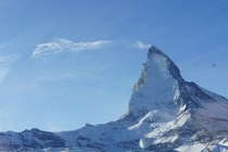 Snow and cloud streak off the top of The Matterhorn Switzerland 