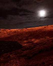 Snow covered mountains lit up by Lava and the Moon  urriss - Iceland