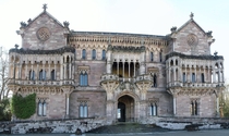 Sobrellano Palace - Comillas Spain - Built in the th cent by the first Marquis of Comillas - Designed by Joan Martorell i Montells - Constructed of stone from Carrejo Spain providing an uneven coloring that highlights the galleries and colonnades - Exteri