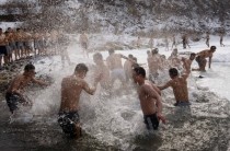 South Korean army soldiers take a dip in ice water during a winter training exercise in Cheorwon 