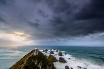 Southerly passing the Nugget Point lighthouse Catlins New Zealand 