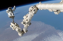 Space rodeo - Stephen K Robinson on the International Space Stations Canadarm - Pic by NASA  