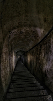 Stairway down to the artillery stand of an abandoned bunker of the Vallo Alpino fortification line in the Alps 