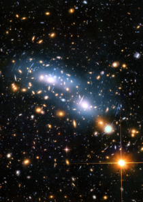 Stars in the Early Universe - This June  image from the Hubble Space Telescope shows the galaxy cluster MACS J
