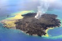 Still Huffing And Puffing Nine months after a new island broke through the surface of the western Pacific Ocean the volcanic eruption at Nishino-shima continues The tiny new volcanic islandmerged into Nishino-shimaand continued to grow Photo by Japan Coas