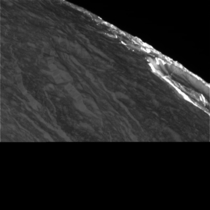 Sunlit crater of Dione