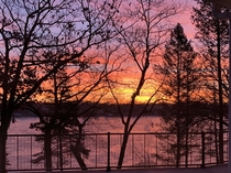 Sunrise over frozen okauchee lake this morning No filter