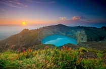 Sunrise over the surreal lake of the Kelimutu volcano on the Flores Island of Indonesia Photo by Shann Biglione 