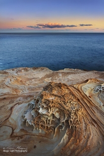 Sunset last night on the rocks at the northern end of Putty Beach in the Bouddi National Park in New South Wales Australia I love the colours shapes and patterns in the sandstone on this headland 