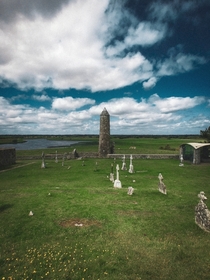 th century round tower over looking the River Shannon at Clonmacnoise Ireland