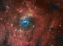 The Bubble Nebula NGC  which contains a hot O-star x larger than our sun near its center 