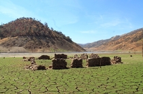The California drought has drained Pine Flat Reservoir exposing a structure from the the turn of the th century that has been under water for  years Story and album in comments 