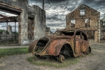 The car of Dr Desourteaux in Oradour-sur-Glane France  by Mike Stuckley