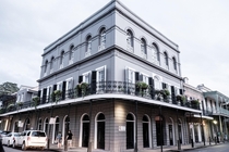 The Charles Caffin Mansion - French Quarter New Orleans Louisiana USA - Three-story stuccoed mansion executed in the Empire style by architect Pierre Trastour for Charles Caffin in  - Built on the site of the former Madame Marie Delphine LaLaurie Mansion 