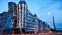 The Dancing House Pragues Nationale-Nederlanden building was designed by Croatian-Czech architect Vlado Miluni and Canadian-American architect Frank Gehry The deconstructionist architecture forms an unusual dancing shape thanks to  concrete panels each a 