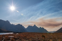 The darkness of a wildfire lingering over the Tombstones Yukon Canada 
