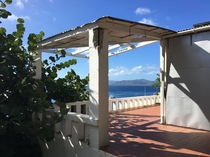 The deck of an abandoned house overlooking the ocean in Cooper Island British Virgin Islands