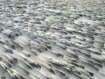The desolate wind-carved beach of the North Arabian Sea outside Duqm Oman 