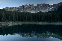 The Dolomites reflecting in Lake Carezza - South Tyrol Italy  by Stefano Baglioni