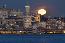 The full moon rising over Seattle and the Smith Tower 