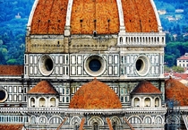 The Gothic style Florence Cathedral is attributed to Arnolfo di Cambio with the dome engineered by Filippo Brunelleschi It remains the largest brick dome ever constructedIt was completed by 