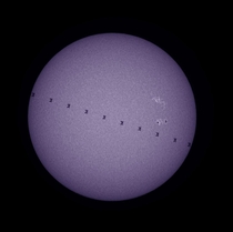 The International Space Station crosses in front of the Sun