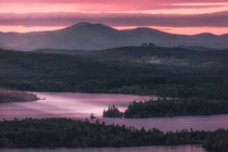 The Lakes Region of New Hampshire is like something out of a dream This is a sunrise over Squam Lake 