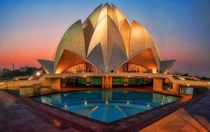 The Lotus Temple in New Delhi India It composed of  free-standing marble-clad petals arranged in clusters of three to form nine sides with nine doors opening onto a central hall
