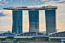 The Marina Bay Sands Hotel Singapore not the drone just to the left of the middle tower and plane near the left-most tower 