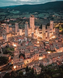 The medieval skyline of San Gimignano a walled hill town with towers dating back to the th century in Siena Tuscany Italy