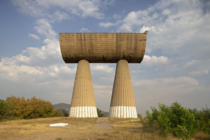 The Miners Monument is situated in the Northern half of Kosovo in the Serbian part of the town of Mitrovica Two columns holding a mining cart represent the mining tradition of the city The monument is a memorial to Mitrovicas Albanian and Serbian miners w
