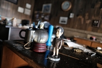 The Monk bobble head and burnt snow globe left behind after a large fire destroyed an office building in Chicago 