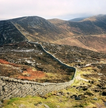 The Mourne Wall Ireland - m x m  kilometers long tops  mountain peaks took  years to build - - built to stop sheep peeing in reservoir Doesnt 