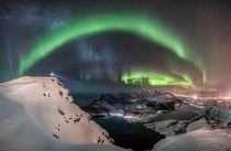 The Northern Lights from atop Offersoykammen mountain in Norways Lofoten Islands