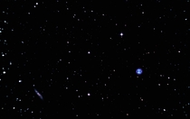 The Owl Nebula M and barred spiral galaxy M 