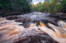 The rootbeer colored water of the Amnicon River in northern Wisconsin is caused by tannins from the decomposition of wetland plants 