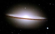 The Sombrero Galaxy -  million light years from Earth - was voted the most beautiful picture taken by Hubble Telescope The dimensions of the galaxy are as spectacular as its appearance It has  billion suns and is  light years across