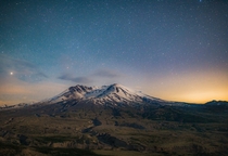 The Stars out with Mount St Helens illuminated by the fading moonlight I believe thats Saturn just rising up on the left 