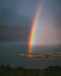 The strongest rainbow Ive ever seen cutting through Torridon Scotland