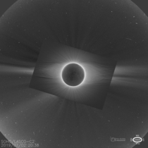 The sun covered by the moon during the Solar eclipse of -- photo by Petr Horalek taken in Chile overlaid on an image of SOHO from Space