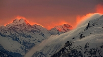 The sunset illuminates the mountains peaks near the St Moritz Swiss mountain resort on January  By Arnd Wiegmann 